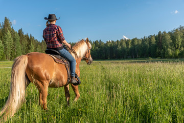 Woman horseback riding