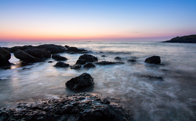 Fototapeta premium sunrise over the sea coast with rocks