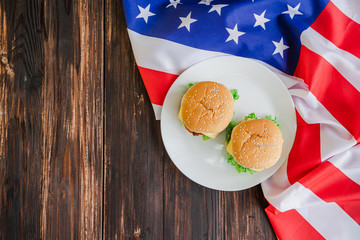 American hamburger or cheeseburger with america flag for USA 4th of July independence day food background concept