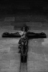 Fototapeta na wymiar Jesus on a cross in a dimly lit church