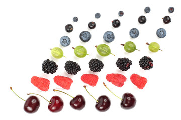 different juicy berries are laid out in rows on a white background