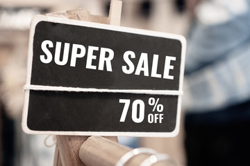 Supper Sale 70% off Mock up wood black advertise display frame setting on clothes line at shopping department store fashion for shop, Business advertisement for custormer concept. Vintage tone