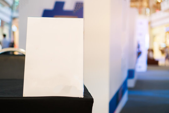 Stand White mockup acrylic frame tent card on counter reception in seminar check in for register, background layout insert space for text of information