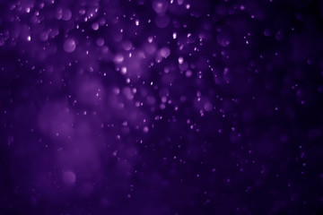 Obraz premium Bokeh purple proton background abstract