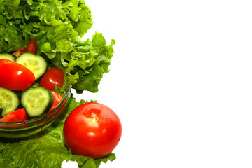 Close-up of colorful organic vegetables on white background.