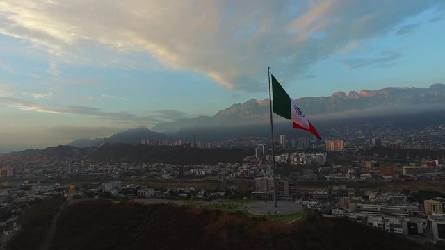 Aerial drone shot of the Mexican flag in the Obispado Hill in Monterrey Mexico.