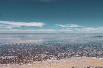 Endless landscapes with reflection like mirror of sky in Salar de Uyuni, Bolivia