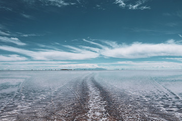 Endless landscapes with reflection like mirror of sky in Salar de Uyuni, Bolivia