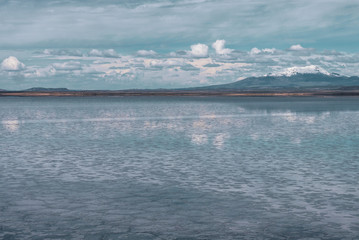 Endless landscapes with reflection like mirror of sky in Salar de Uyuni, Bolivia