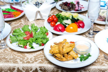 Dishes on a served banquet table  in restaurant