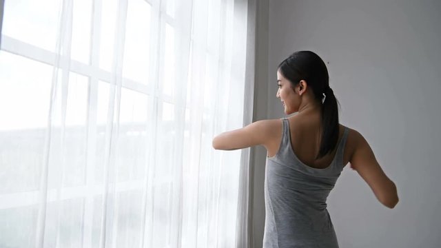Holiday concept. Women are waking up in the morning in the room.