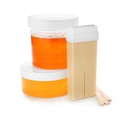 Wax and sugaring paste for hair removing on white background