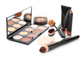 Set of cosmetics for contouring makeup on white background
