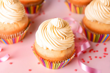 Tasty Birthday cupcakes on color background, closeup