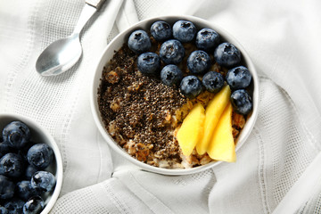 Bowl with tasty chia dessert on table
