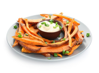 Plate with tasty cooked sweet potato and sauce on white background