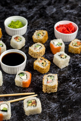 Set of sushi and maki on stone table. Top view