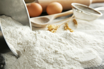 Heap of flour on table, closeup