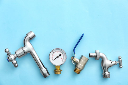 Set of plumbing items on color background