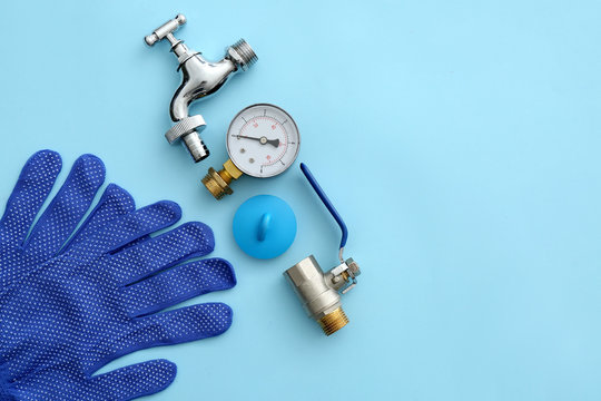Set of plumbing items on color background
