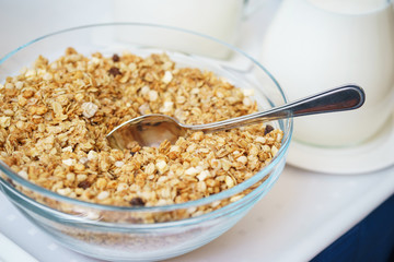Bowl of nuts, dried fruit and muesli for the preparation of a nutritious vegetarian breakfast. 