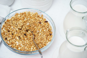 Bowl of nuts, dried fruit and muesli for the preparation of a nutritious vegetarian breakfast. 