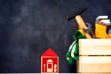 construction tools in wooden box in black background