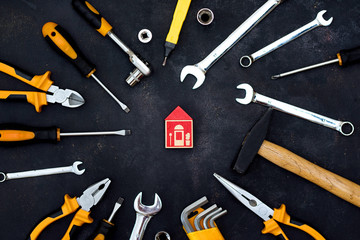 construction tools in wooden box in black background