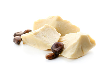 Pieces of cocoa butter on white background