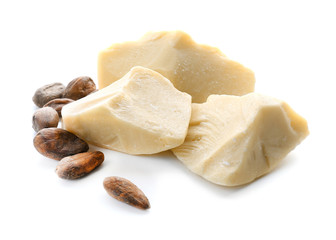 Pieces of cocoa butter on white background - obrazy, fototapety, plakaty