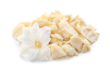 Pieces of cocoa butter on white background