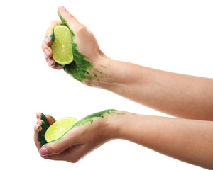 Painted female hands with lime on white background