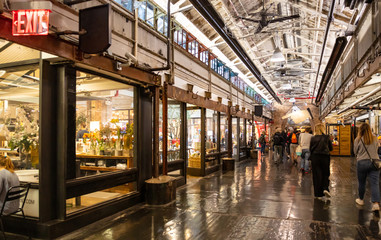 Fototapeta na wymiar USA, New York, Chelsea market. People walking in the hall