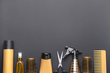 Set of hairdresser tools and accessories on dark background