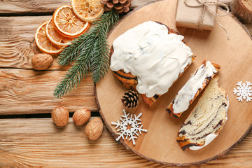 Composition with tasty cut poppy pastry and Christmas decor on table