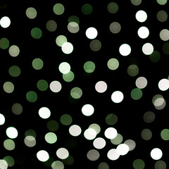 Unfocused abstract colourful bokeh black background. defocused and blurred many round green light