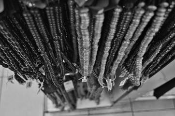 black and white image of traditional wooden prayer beads or tasbih on display for sale