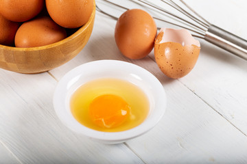 Fresh egg yolks in a porcelain bowl