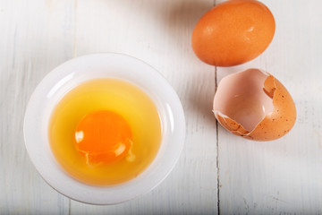 Fresh egg yolks in a porcelain bowl