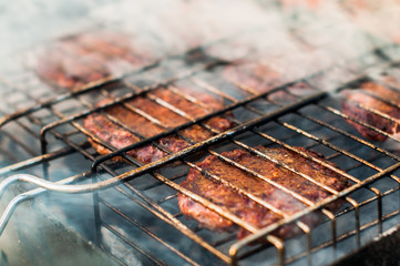 A delicious steak cooking on barbecue