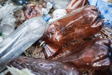Biodegradable waste. Ecology problem.Empty plastic in the natures.