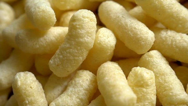 Many yellow corn sticks. Rotation.