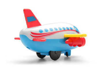 colourful plastic toy plane on white background