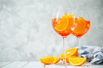 Aperol and ingredients drinks on wood background, copy space