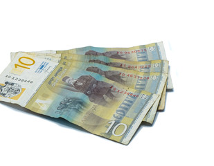 Four  banknotes worth 10 Serbian Dinars with a portrait of a Linguist Vuk Karadzic isolated on a white background