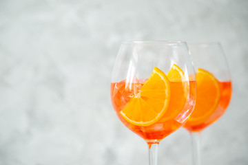 Aperol and ingredients drinks on wood background, copy space
