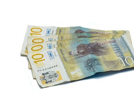 Four  banknotes worth 10 Serbian Dinars with a portrait of a Linguist Vuk Karadzic isolated on a white background