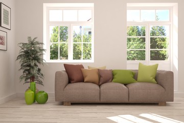 Stylish room in white color with sofa and summer landscape in window. Scandinavian interior design. 3D illustration
