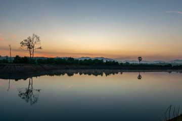 Fototapeta na wymiar View at Ban Thong Suk Reservoir, Songkhla, Thailand at sunrise.