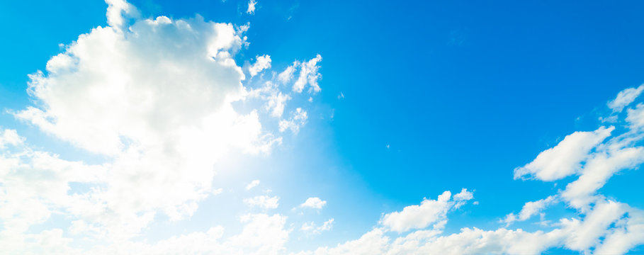 Shining sun and soft clouds in the blue sky © Gabriele Maltinti